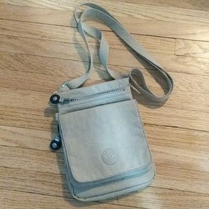 Cute little tan Kipling purse